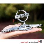 آرم ایستاده روی کاپوت نیسان بالدار